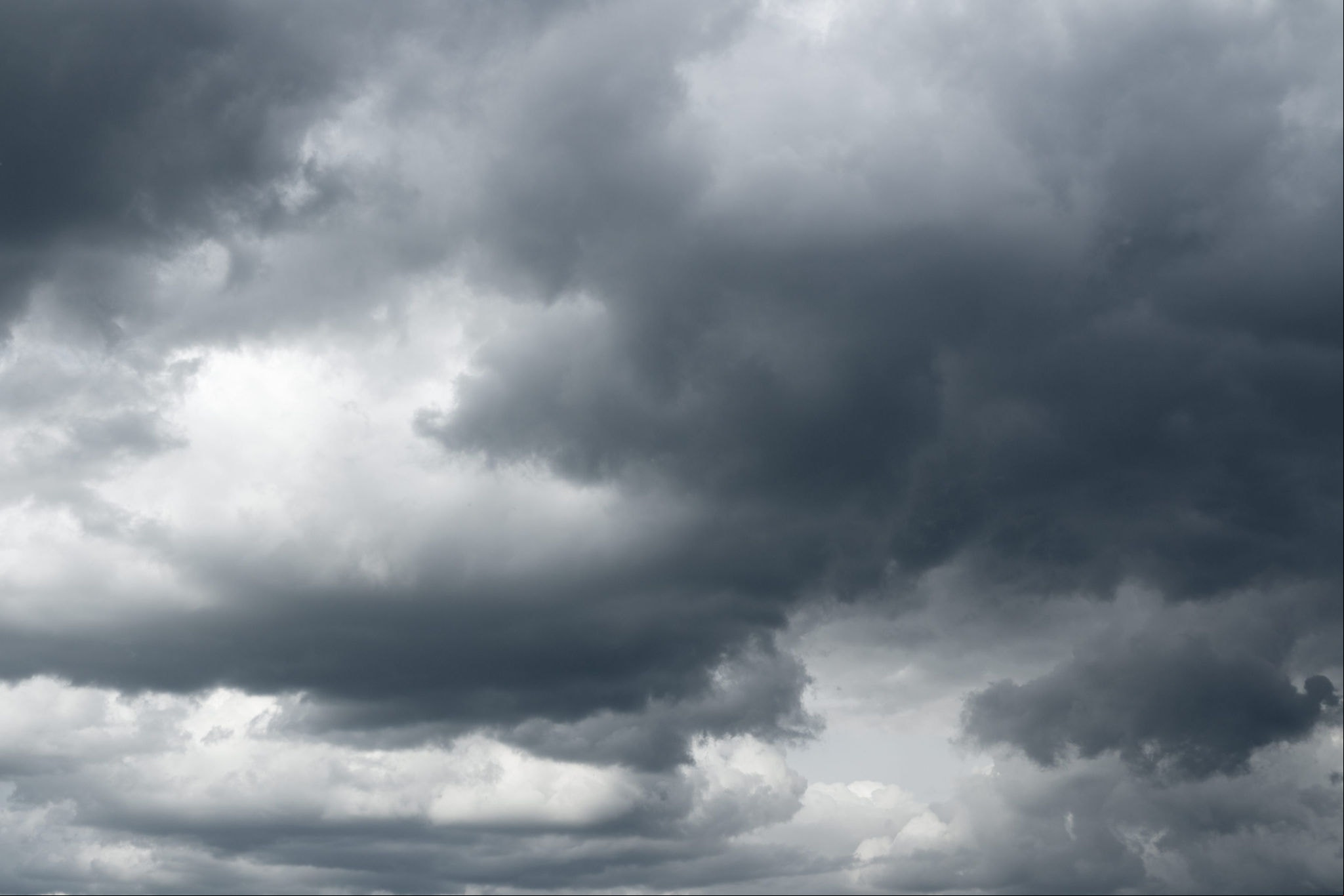 Thunderclouds over horizon, dark, gray.
